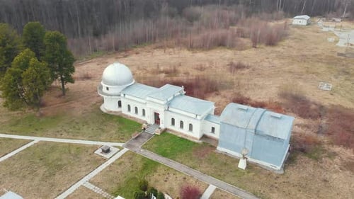 Observatory and Other Buildings on the Field Surrounded By Bare Trees