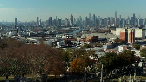 Forwards Fly Above Historic Calvary Cemetery and Surrounding Town Borough