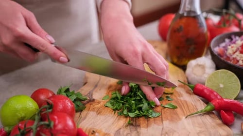 Chopping fresh herbs for a culinary recipe