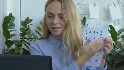 Teacher Explaining Math Problems in Online Lesson
