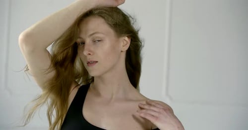 Young Woman Posing in a Fashionable Style