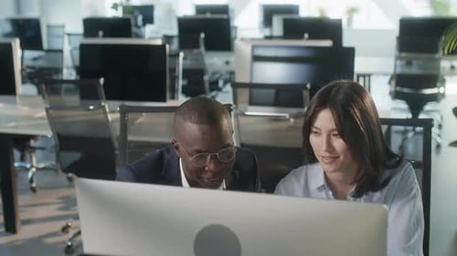 Creative Business Colleagues Using Desktop Computer in Office