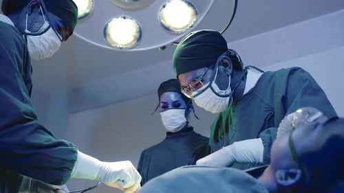 Surgeons Performing Operation in Hospital Operating Room