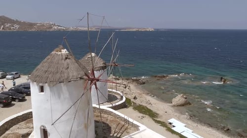 Aerial view of traditional windmill near the coast, Greece.