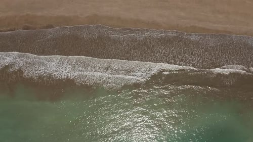 Drone view of waves and shoreline