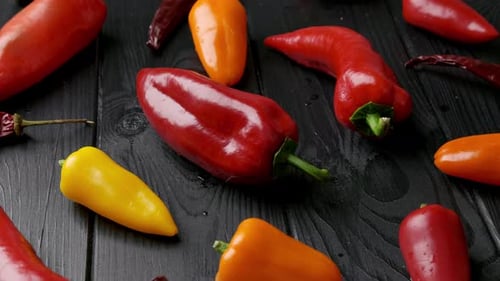 Colorful Peppers on Dark Wood Surface