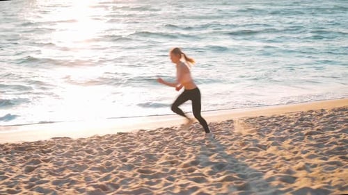 Sporty Blonde Woman Running Ocean Beach