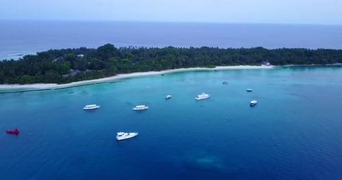 Wide aerial tourism shot of a summer white paradise sand beach and aqua turquoise water background i