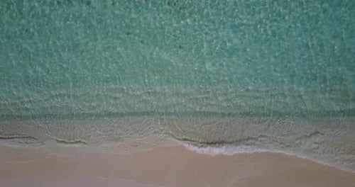 Luxury birds eye clean view of a white sand paradise beach and aqua turquoise water background