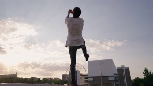 Male Parkour Athlete Performs Somersault Screw Backdrop Beautiful Sunset Sky