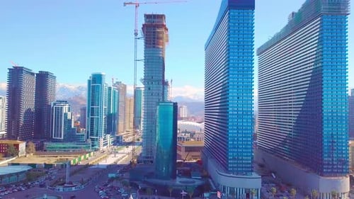 The process of construction of high-rise modern buildings in the city center.