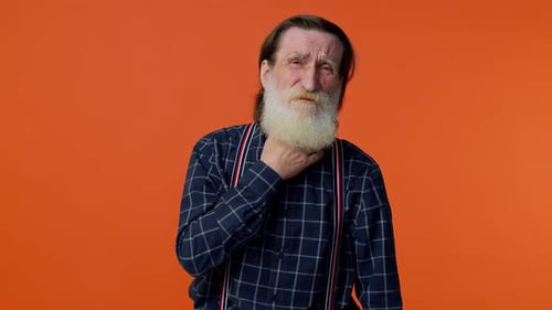 Senior Man Expressing Discomfort and Chest Pain