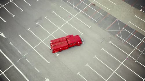 Red Fire Truck in Empty Parking Lot Aerial