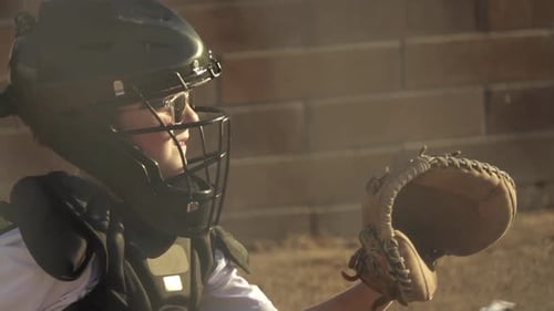 Boy in Protective Gear Practices Baseball Catching