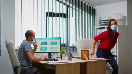 Professionals Working Together in Modern Office Environment