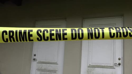 Crime Scene Tape Blocking Apartment Doors