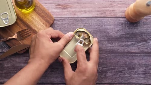 Opening Tin of Sardines in Olive Oil