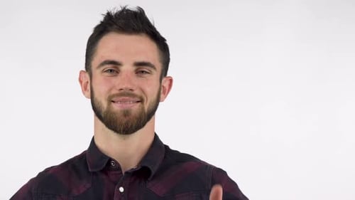 Man Smiling and Giving Thumbs Up Gesture