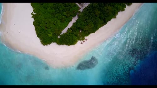 Aerial drone landscape of relaxing coast beach holiday by blue green sea with white sandy background