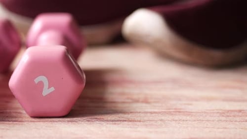 Pink Dumbbells and Hand Grip for Exercise
