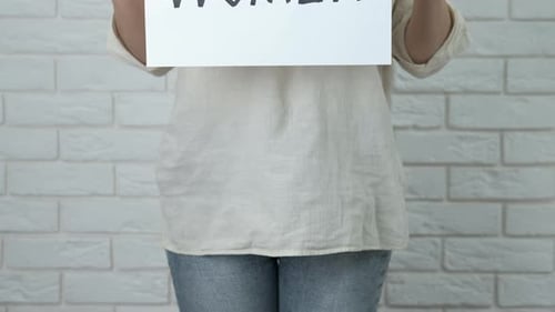 Holding a Sign That Says Women