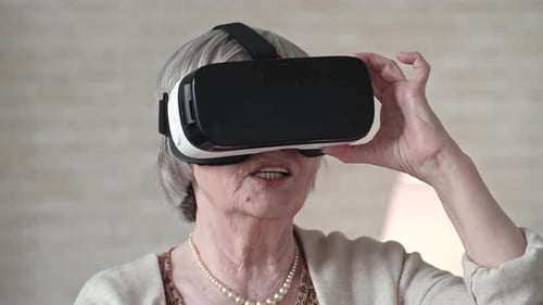 Senior Woman Experiences VR Headset Technology