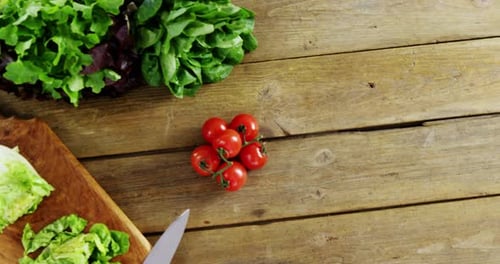 Fresh Salad Ingredients on Rustic Table