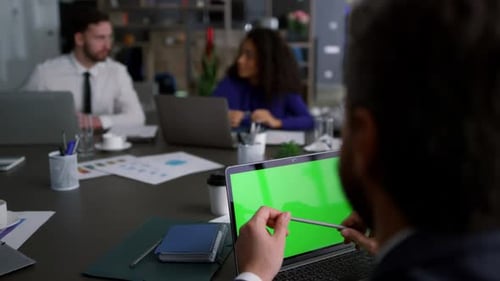 Multiracial Business Team Meeting Use Laptop Chroma Key Research Data in Office