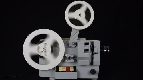 Vintage Movie Projector Operating with Spinning Reels