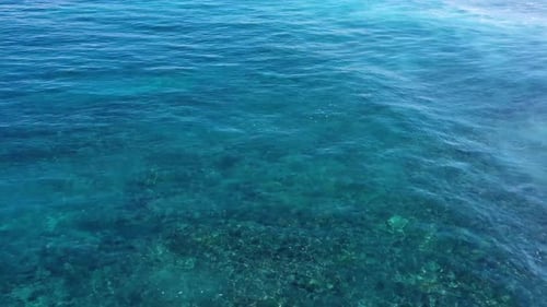 Indonesia. Waves and azure water as a background. View from drone at the ocean surface.