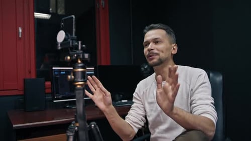 Caucasian Man Broadcasts Live Through a Smartphone on a Social Network