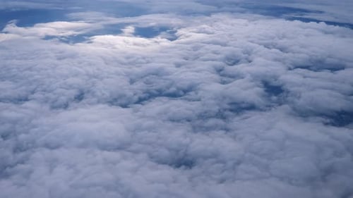 Aerial View of Fluffy White Clouds and Blue Sky