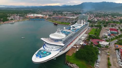 Aerial View of Cruise Ship Docked in Port City