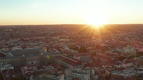 Backwards Fly Above City Reveal of Town Development and Trees in Park