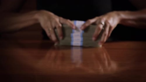 Stacks of Money Arranged on a Table