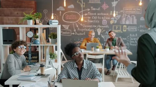 Cheerful Muslim Business Lady Praising Office Workers Giving Good News Applauding