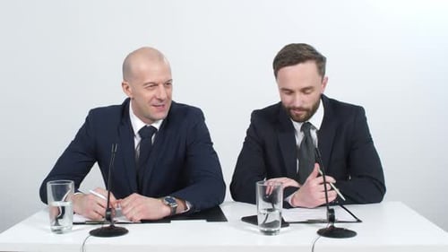 Men in Suits Speak at Corporate Press Conference