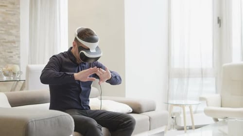 Man Wearing VR Headset Interacting With Virtual Reality