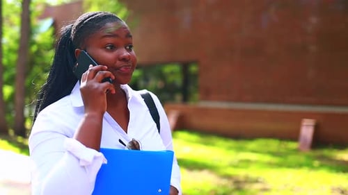Young Woman Talking on Phone Outdoors