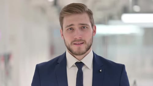 Young Adult Businessman Talking in Close-Up Shot