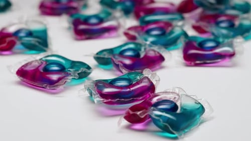 Colorful Detergent Pods on White Surface