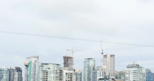 Man Checking Watch After Exercise in Urban Setting
