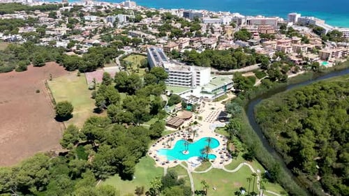 Aerial drone footage of hotels and swimming pools on the Spanish island of Majorca Mallorca, Spain
