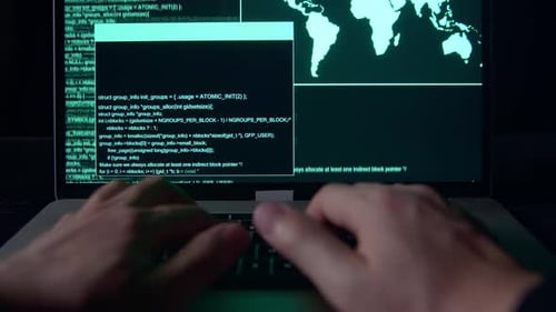 Hands Typing Code on a Laptop at Night