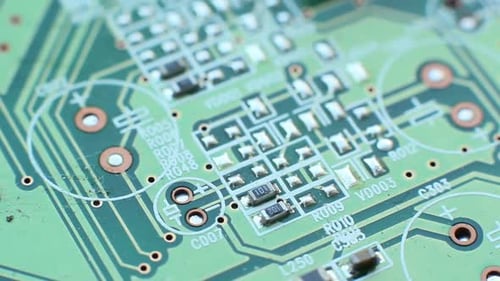 Green Circuit Board Close Up Showing Electronic Components