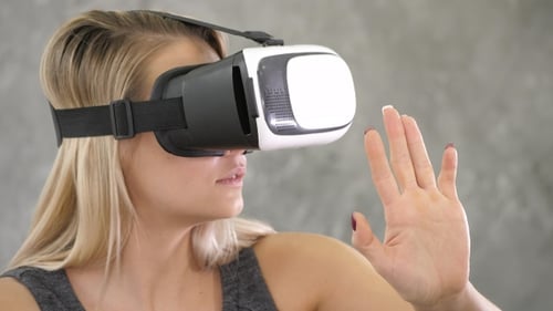 Woman Enjoys Using Virtual Reality Headset