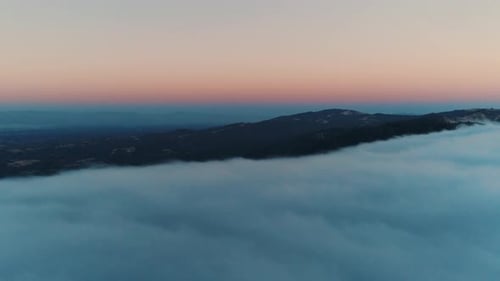 Flying Over Dusk Clouds