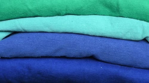 Folded Stack of Colorful Cotton T-shirts