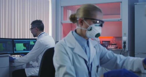 Scientists Working in Bright Modern Laboratory