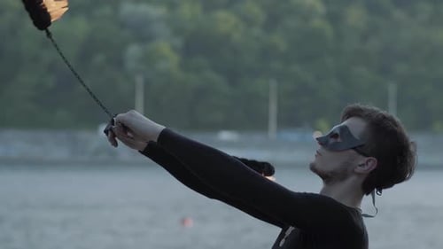 Man Performing a Dynamic Fire Show in the City